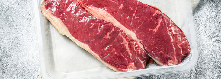 Fresh meat, vacuum packaged sealed marbled beef, New York strip steak